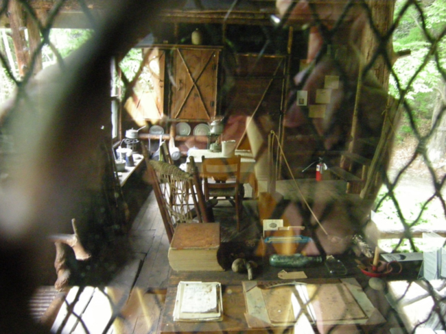 View of Burroughs’s writing desk and kitchen through the window, Slabsides, May 2015.
