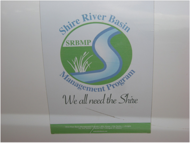 Logo for the Shire River Basin Management Program on the door of a project vehicle, Annie’s Lodge, Zomba