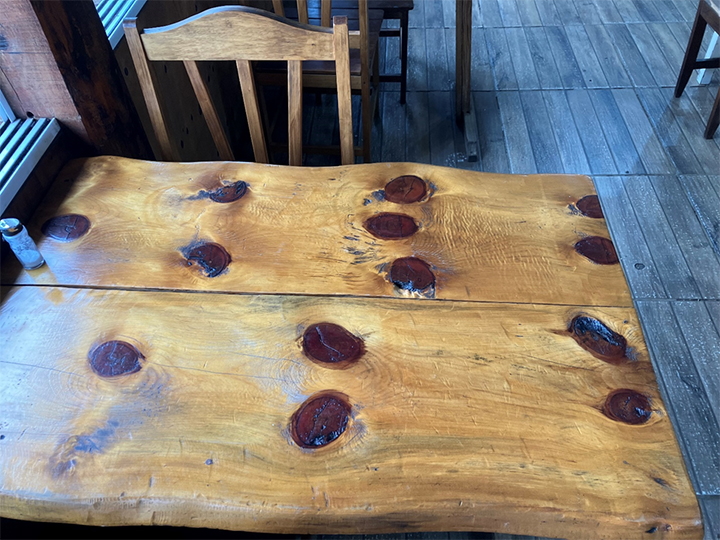Araucaria table at roadside restaurant near Três Barras
(cores from whirls of branches make lines of dark circles)